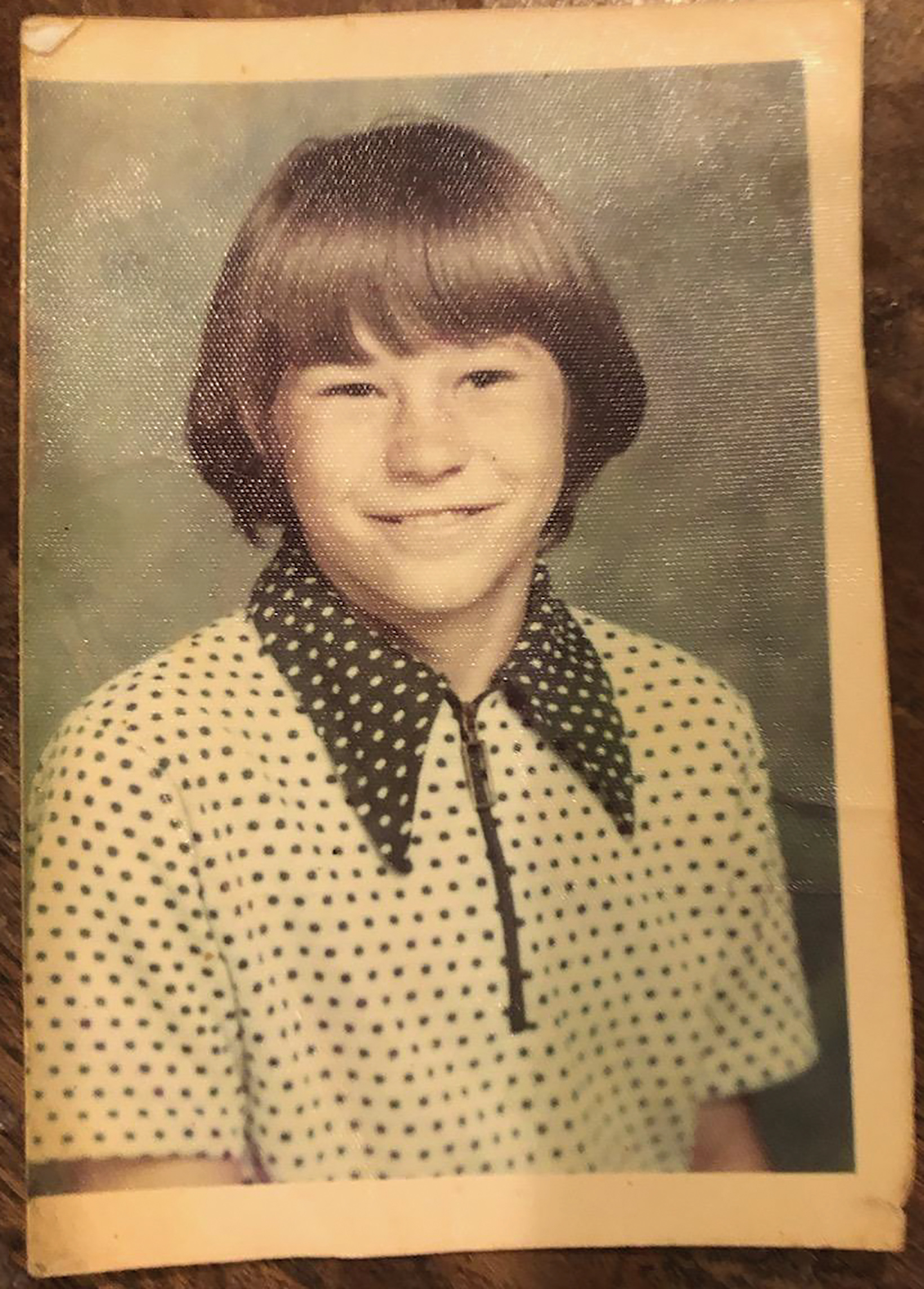 Damaged photo — before